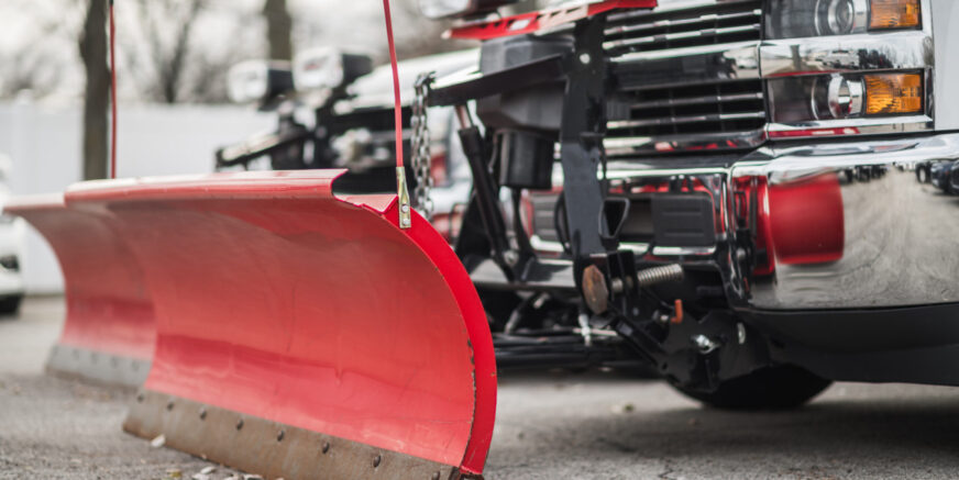 Snow Plow Pickup Trucks Awaiting Winter Season. Commercial Grade Plowers. Transportation Industry Theme.